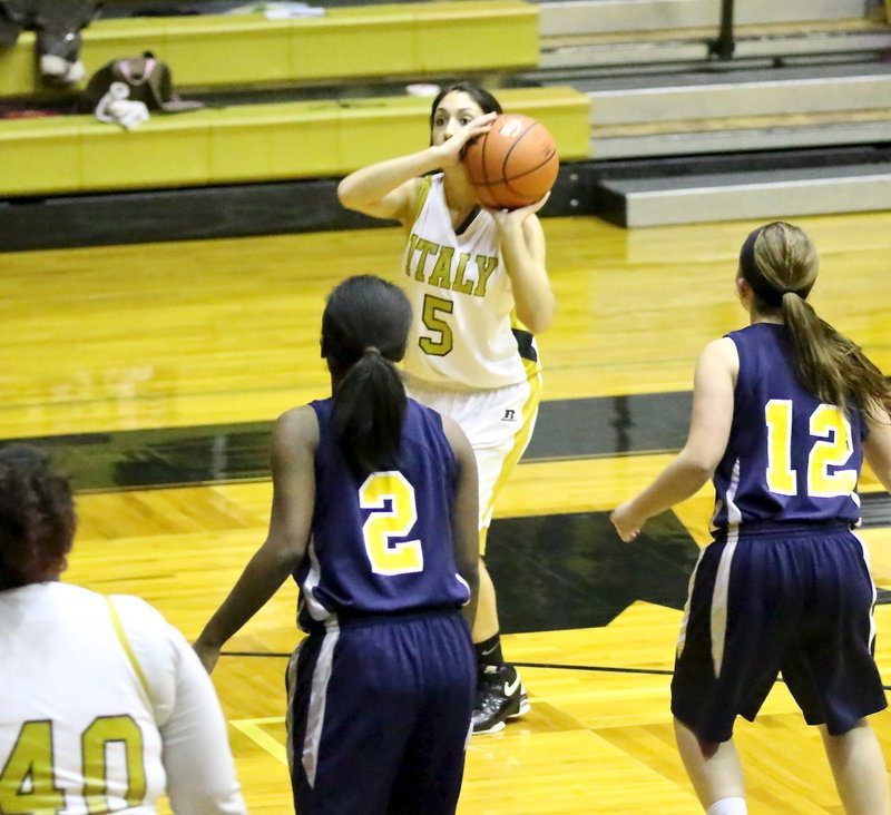 Image: Lady Gladiator, Lizzy Garcia(5) takes aim on a jump shot.