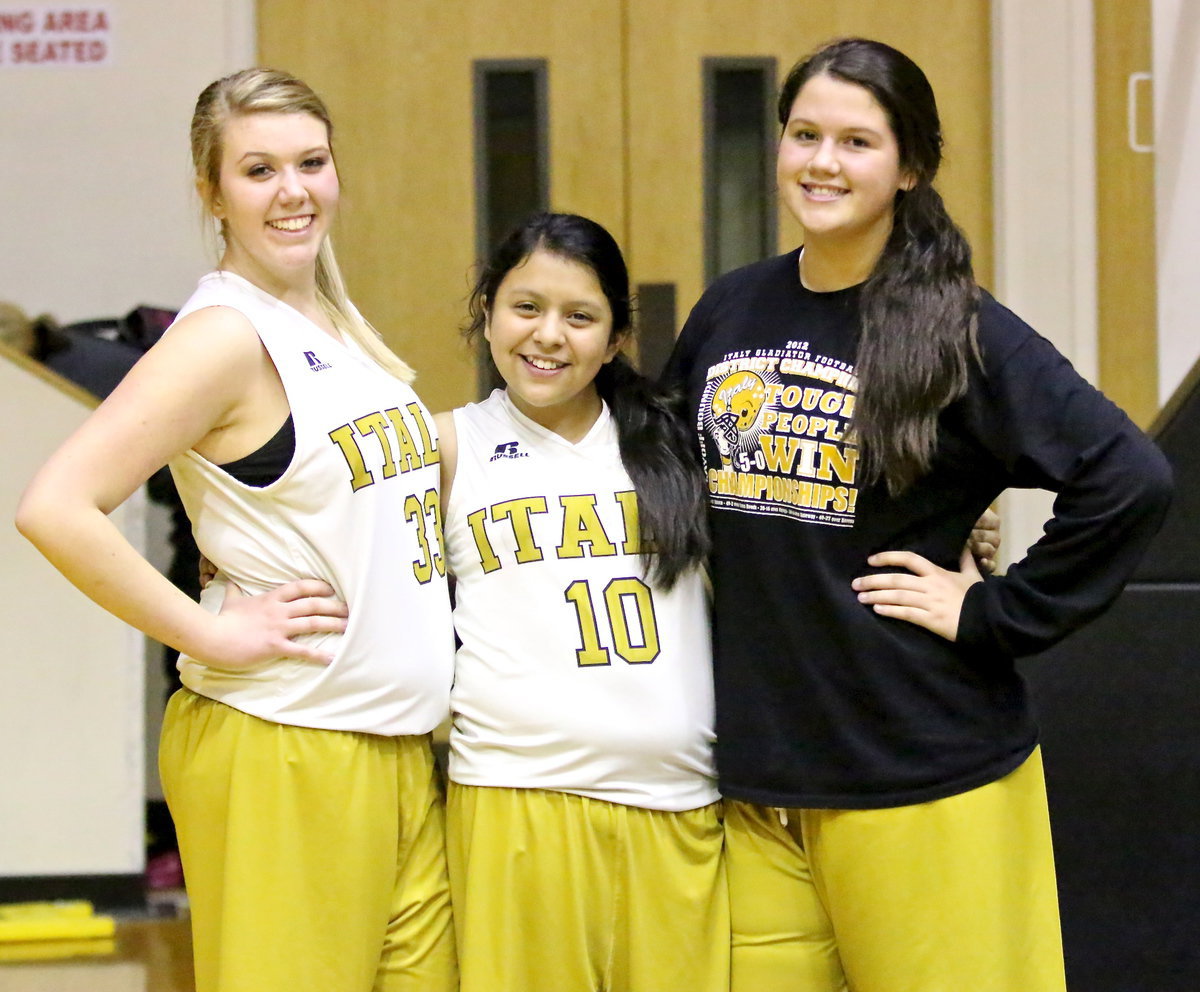 Image: Sydney Weeks(33), Noeli Garcia(10) and Jenna Holden(25) are pleased with their 8th grade team’s performance against Mildred.