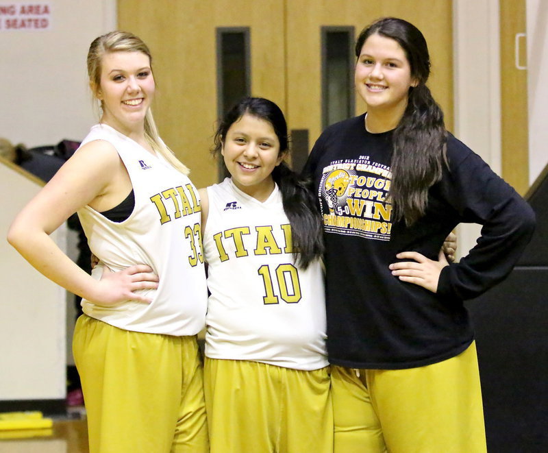 Image: Sydney Weeks(33), Noeli Garcia(10) and Jenna Holden(25) are pleased with their 8th grade team’s performance against Mildred.