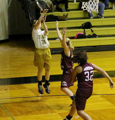 Image: Tatum Adams(31) spins and hits the shot of the night from the far corner.