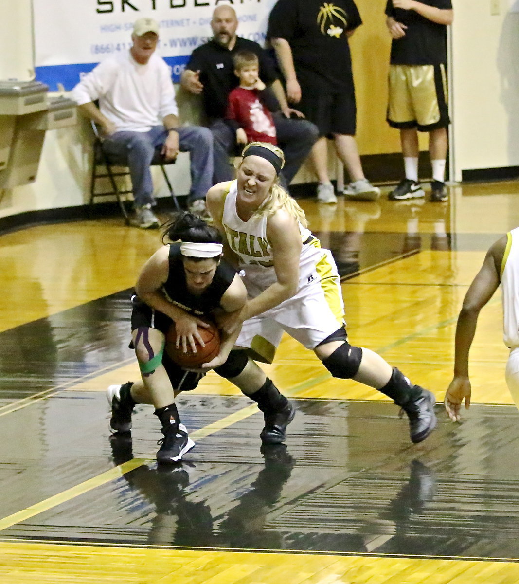 Image: The strain on the face of Italy’s Jaclynn Lewis(13) tells the tale of a physical battle between the Lady Gladiators and the Triple A Academy Lady Stallions. Triple A got the win but the Lady Gladiators won even more.