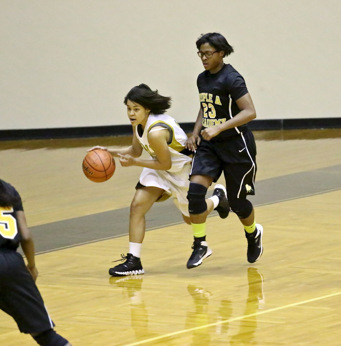 Image: Lady Gladiator Alex Minton sprints the ball up the floor.