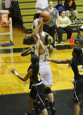 Image: Jaclynn Lewis(13) is fouled while shooting and gets to attempt a couple of foul shots late in the game.