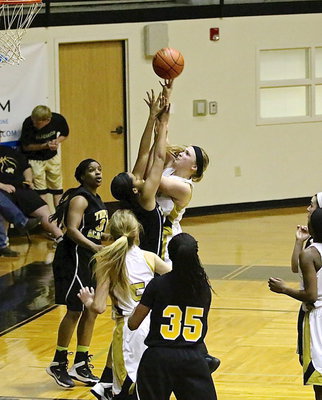 Image: Jaclynn Lewis(13) goes up strong over a Triple A defender.