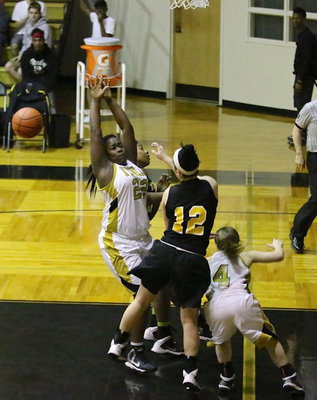 Image: Taleyia Wilson(22) and teammate Tara Wallis(4) try to disrupt an outlet pass by Triple A.