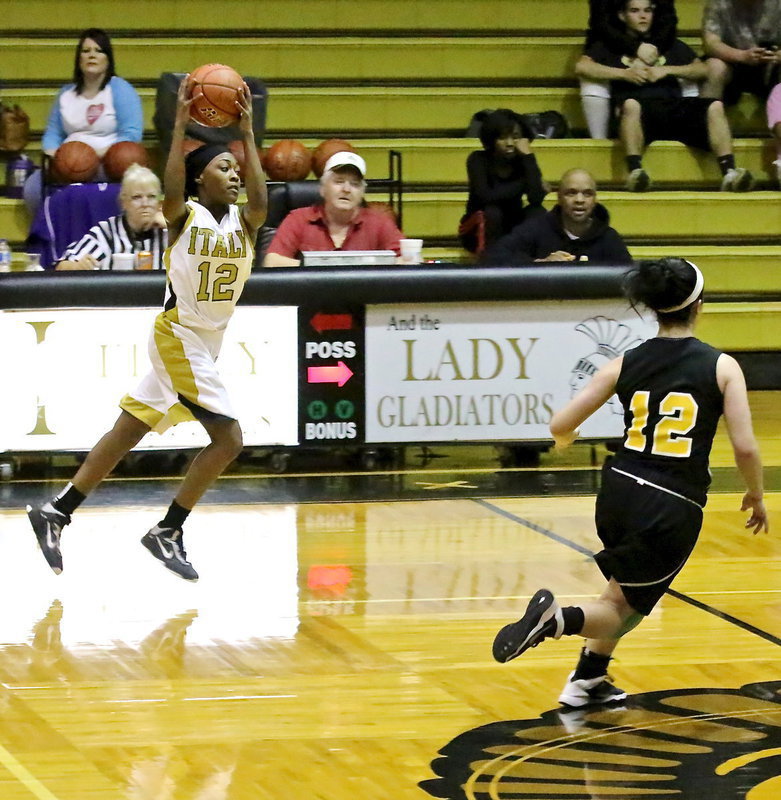 Image: K’Breona Davis(12) catches the pass while on the go to beat Triple A’s full court press.