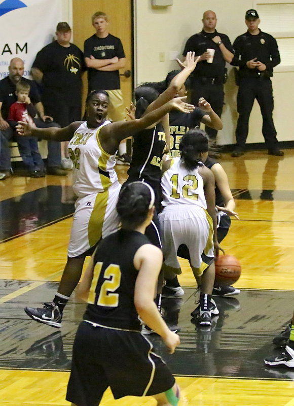 Image: Taleyia Wilson(22) and K’Breona Davis(12) battle for a rebound.