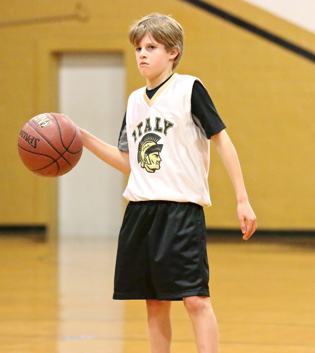 Image: Reese Janek(8) is stoic as he spans the Hillsboro defense for a crease.