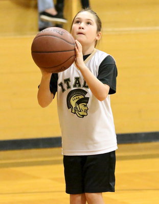 Image: IYAA’s Hiley Mauldin(2) eyes the goal before trying a layup prior to the start of the 3rd/4th grade girls game against Abbott.