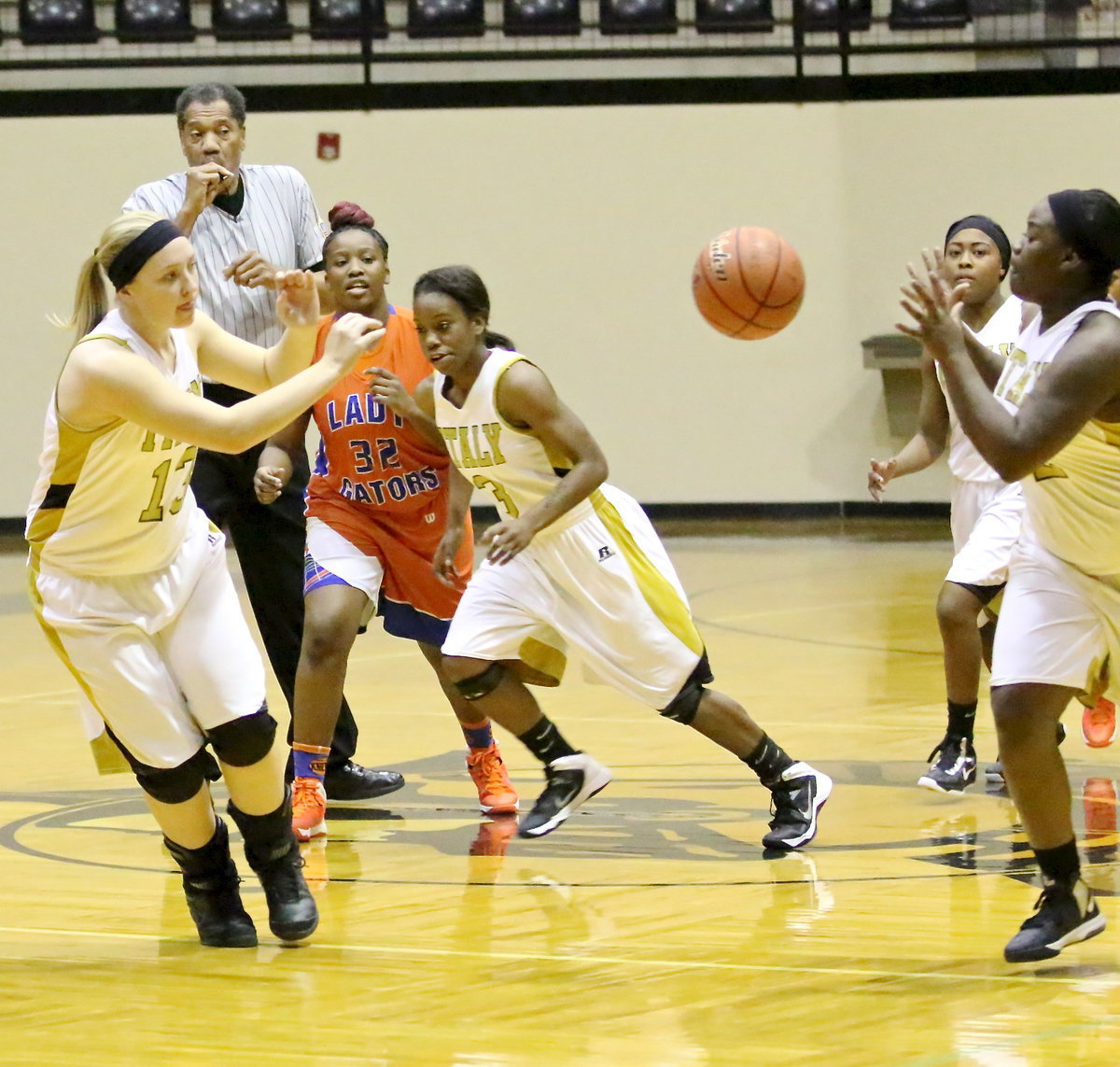 Image: Jaclynn Lewis(13) passes to teammate Taleyia Wilson(22).