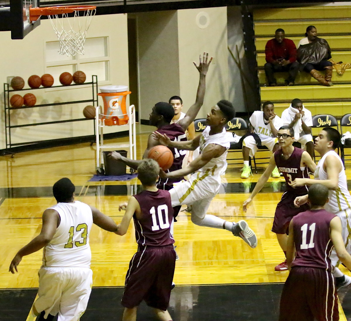 Image: Senior Gladiator Trevon Robertson(22) attacks the basket.