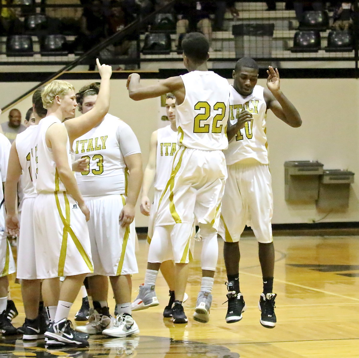 Image: Trevon Robertson(22) and TaMarcus Sheppard(10) do that cool bump thing in the air.