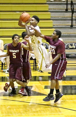 Image: Trevon Robertson(22) is fouled while attempting a 3-pointer.