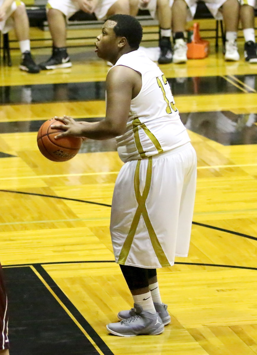 Image: Senior Gladiator Darol Mayberry(13) puts in a free-throw.