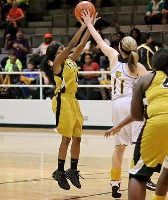 Image: Kendra Copeland(10) tries a jumper from the top of the lane.