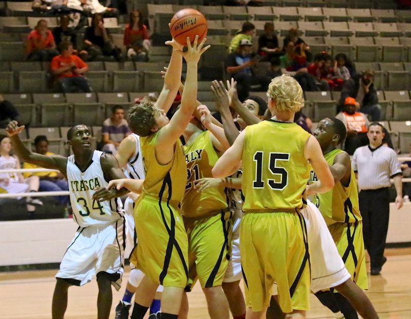 Image: Gladiator Bailey Walton(14) comes out of the pile up with the ball.