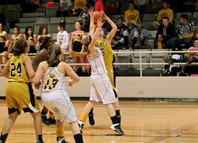 Image: Lady Gladiator Halee Turner(5) shoots a jumper from beyond the lane.