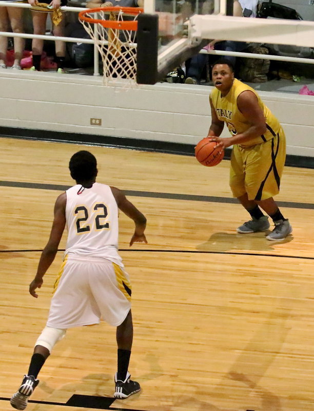 Image: Senior Darol Mayberry(13) takes a long look at a deep three-ball.