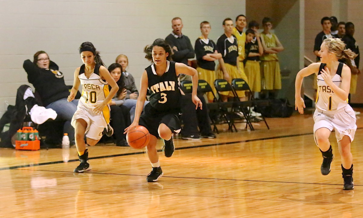 Image: Guard Alex Minton(3) generates a fast break opportunity.