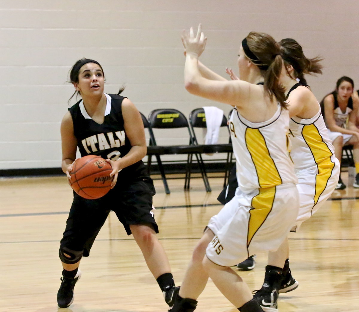 Image: Ashlyn Jacinto(13) makes a move toward the hoop.