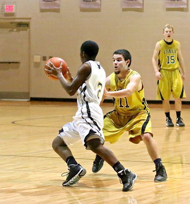Image: Tyler Anderson(11) mans up on defense against an Itasca ball handler.