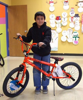 Image: Tello Salazar (4th grade) won a bike for perfect attendance.