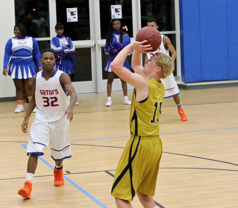 Image: Italy’s Cody Boyd(15) spots up for a jumper.