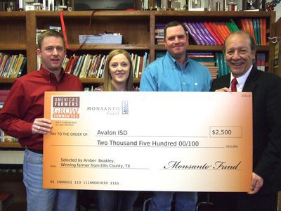 Image: Doug Pustejovsky (sales manager with Monsanto Company), Amber and Steven Beakley(sponsors) and Dr. DelBosque holding the check.