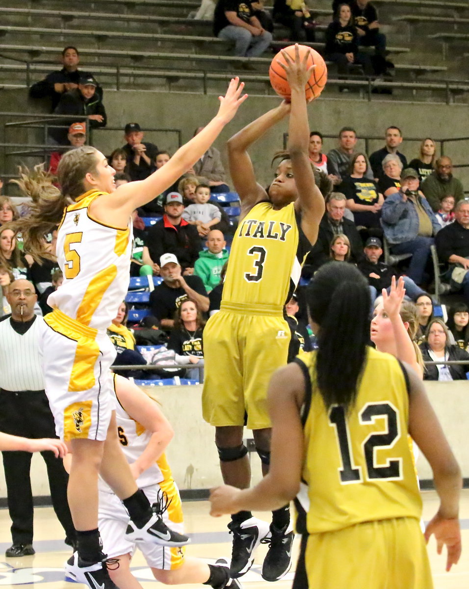 Image: Lady Gladiator Kortnei Johnson(3) rises up and knocks down a jumper over an Era defender.