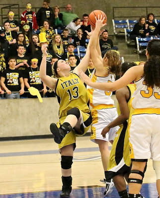 Image: Lady Gladiator Jaclynn Lewis(13) tries for an offensive rebound early in the contest.