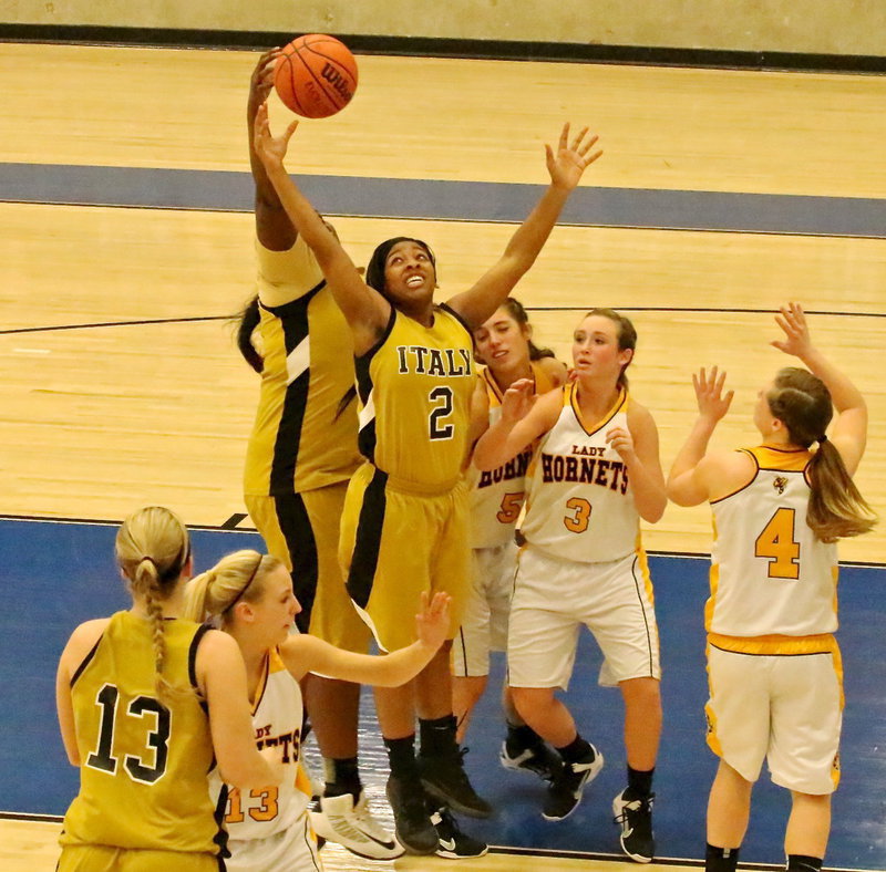 Image: Lay Gladiator senior forward Bernice Hailey(2) stretches for a rebound with teammate Cory Chance(40).