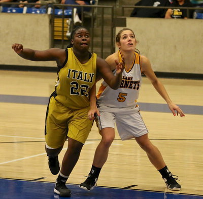 Image: Lady Gladiator Taleyia WIlson(22) makes a move to get good rebounding position.