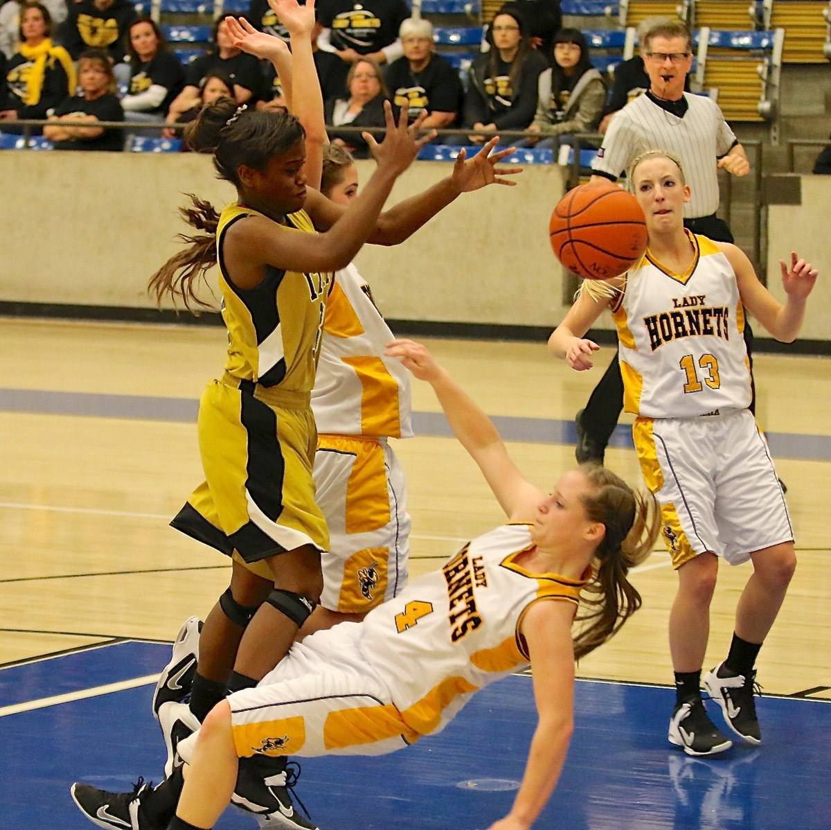 Image: Lady Gladiator Kortnei Johnson(3) is fouled going up for the shot against Era.