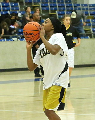 Image: Lady Gladiator K’Breona Davis(12) tries a jump shot during the pre-game warmups.