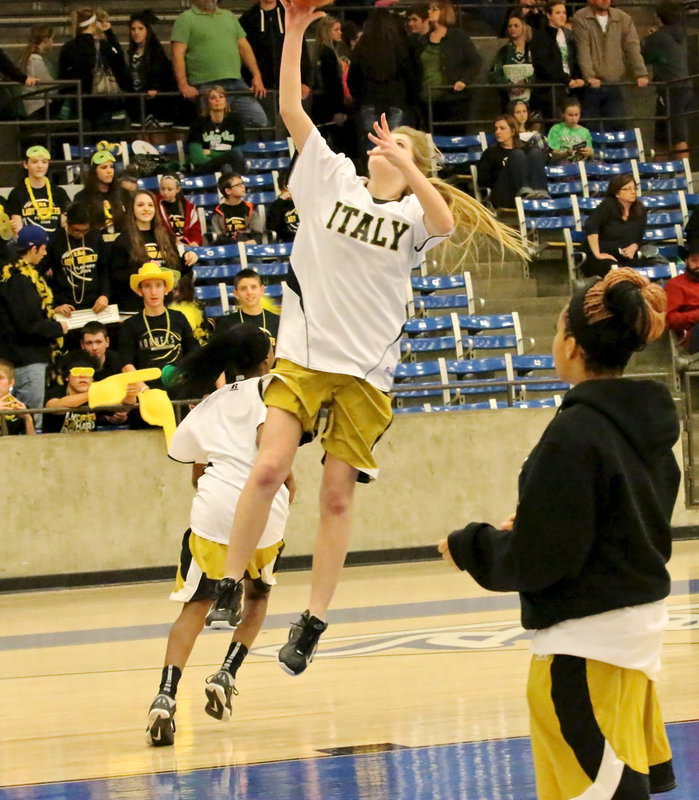 Image: Lady Gladiator Halee Turner(5) displays her skills during the pre-game warmups.