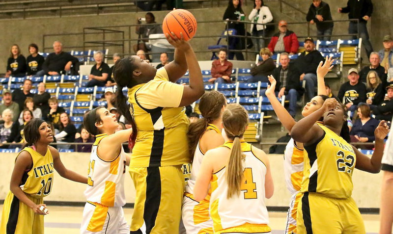 Image: Lady Gladiator Cory Chance(40) grabs an offensive rebound and scores the put back.