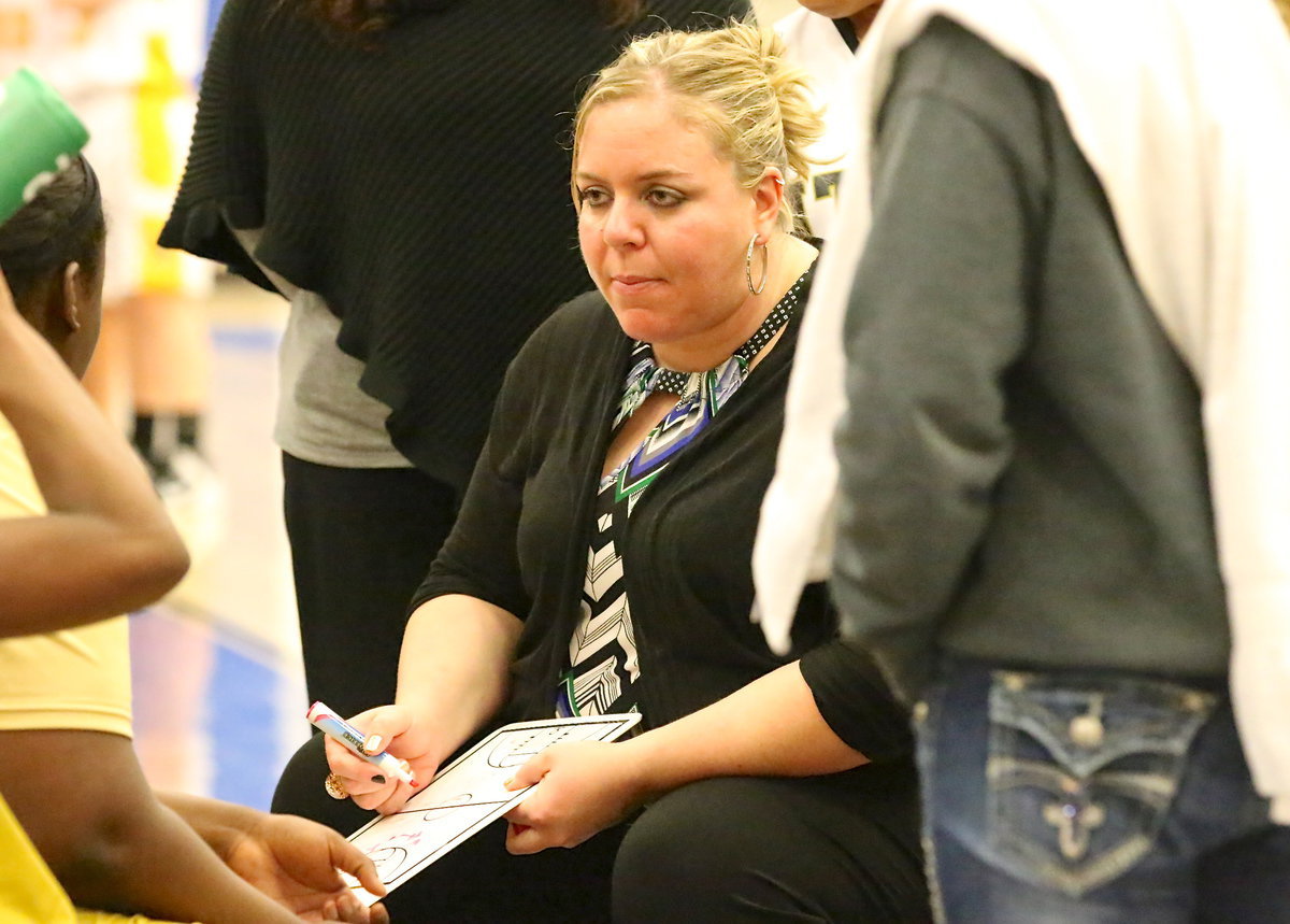 Image: Lady Gladiator head coach Melissa Fullmer draws up a play during a timeout.