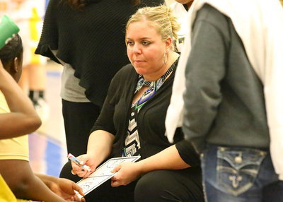 Image: Lady Gladiator head coach Melissa Fullmer draws up a play during a timeout.