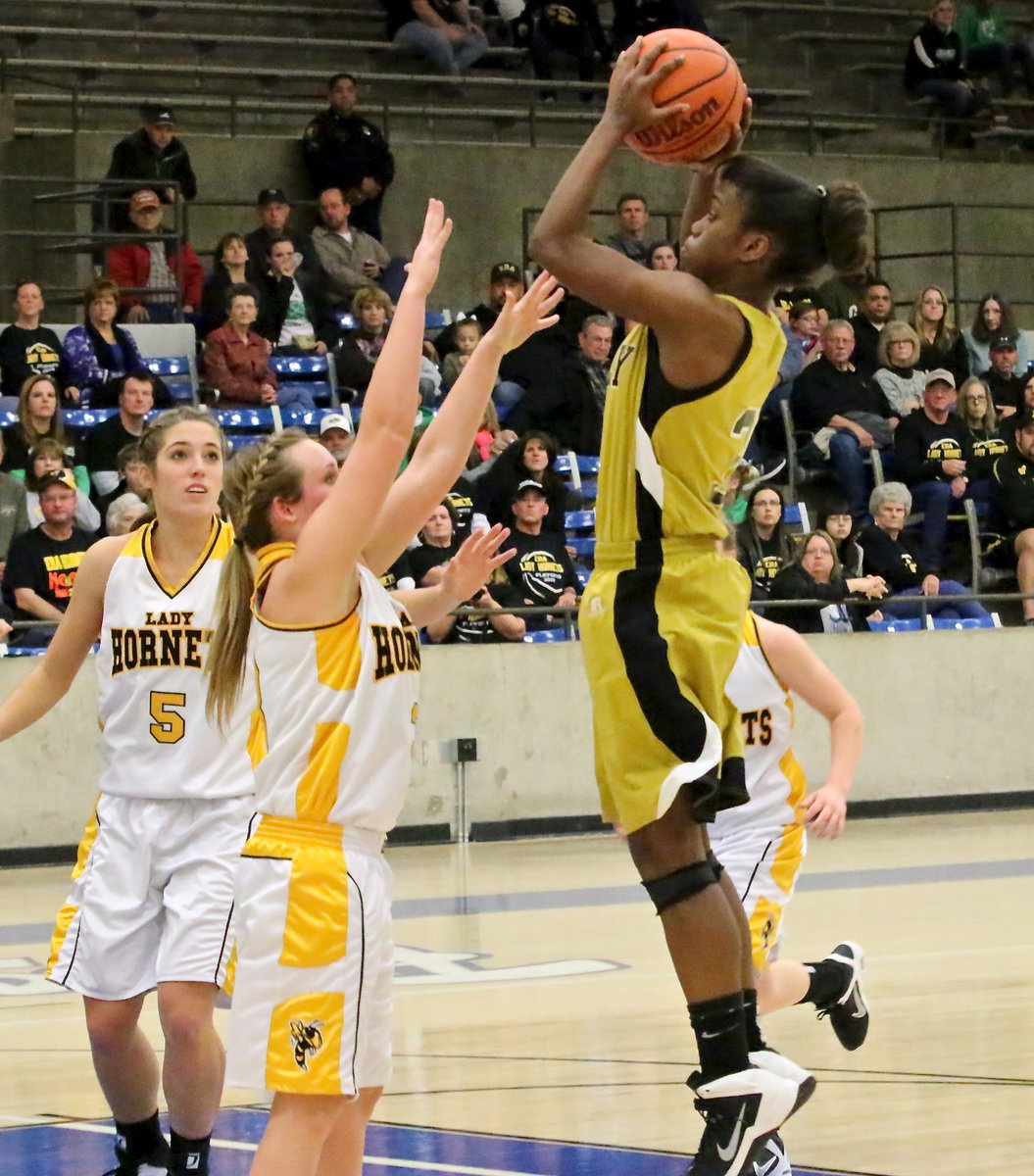 Image: Lady Gladiator Kortnei Johnson(3) goes up for two of her 26-points against Era.