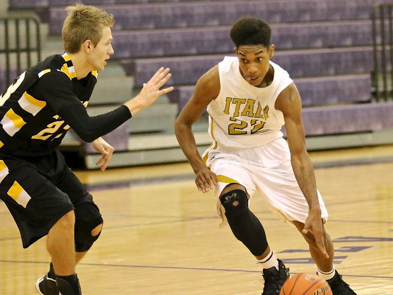 Image: Gladiator Trevon Robertson(22) makes a move down the lane.