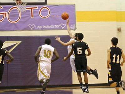 Image: Tyler Anderson(11) scores off a quick move to the basket to help seal the deal against Itasca.