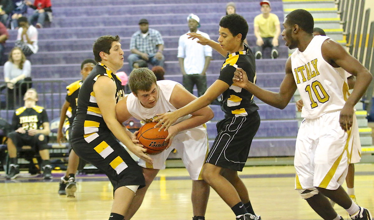 Image: Gladiator Zain Byers(21) refuses to loose the rebound and uses his strength to ward off a couple of pawing Wampus Cats.