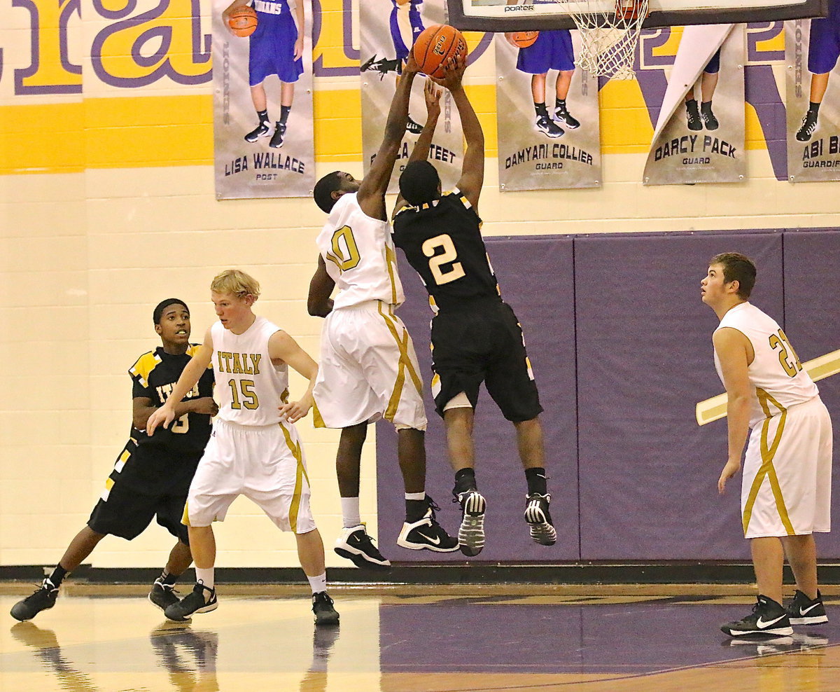 Image: Gladiator TaMarcus Sheppard(10) appears to cleanly block a Wampus Cat shot attempt but the skilled senior is called for a shooting foul.