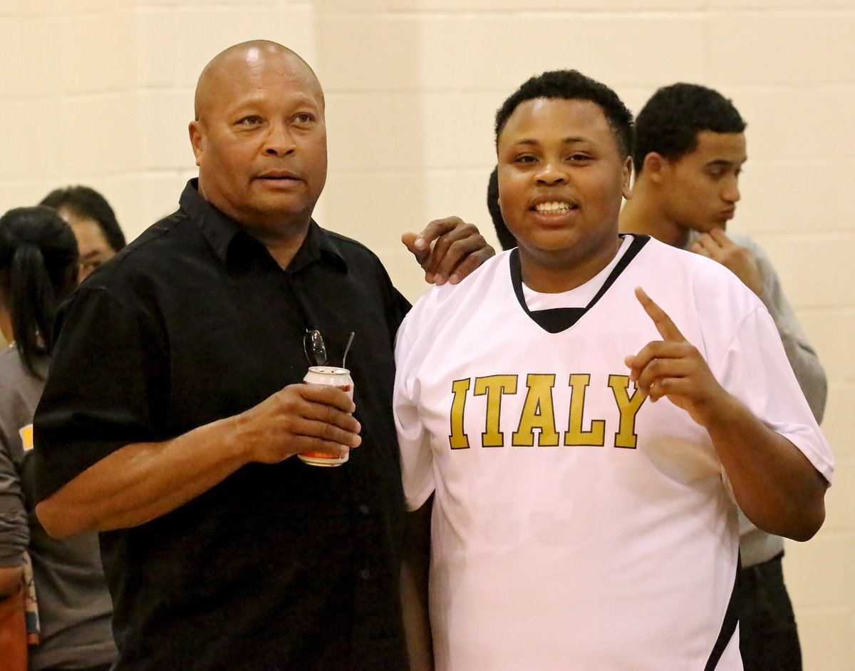 Image: Darol Mayberry(13), who scored 5-points in the win over Itasca including a 3-pointer under pressure, get congratulated by his father, Larry Mayberry, Sr.