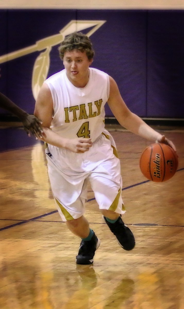 Image: Gladiator Bailey Walton(4) pushes the ball up the court.