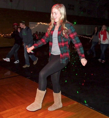 Image: Junior class representative Madison Washington shows the kiddos how its done on the dance floor.