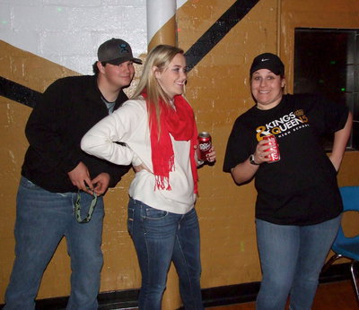 Image: Juniors John Byers and Kelsey Nelson, along with parent chaperone Amber Droll, monitor the junior class sponsored 2014 Italy Junior High Valentines Dance.