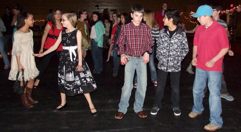 Image: Aliyah Turner, Jennifer Salas, Hannah Coffman, Colby Hampton, Michael Gonzalez and Brennon Sigler work it out on the dance floor during the 2014 Italy Junior High Valentines Dance sponsored by Italy High School’s junior class.