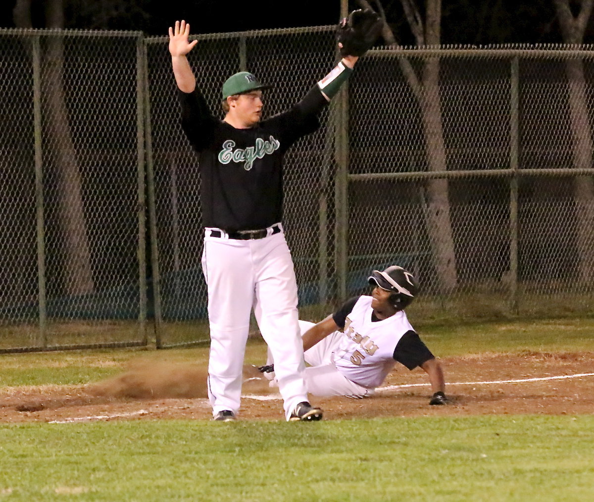 Image: Italy’s Kenneth Norwood, Jr.(5), slides safely into third after after hitting a two-run triple.