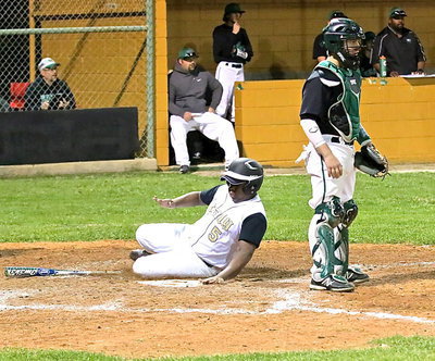 Image: Kenneth Norwood, Jr.(5) slides across home plate for an Italy run.
